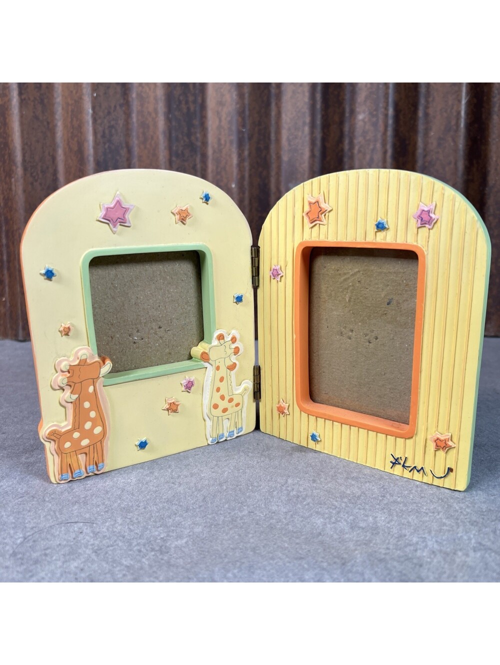 CARTERS, HAND PAINTED, BI-FOLD FRAME, HOLDS 1 - 21/4” & 1 - 21/4” X 33/8” PHOTO